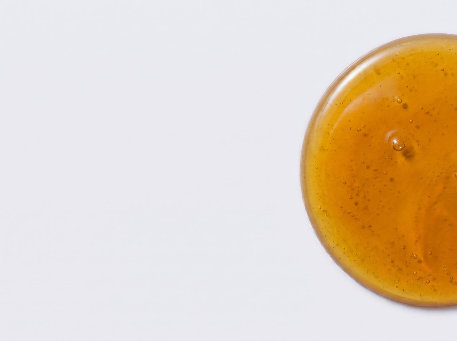 Oil pooled on a light surface